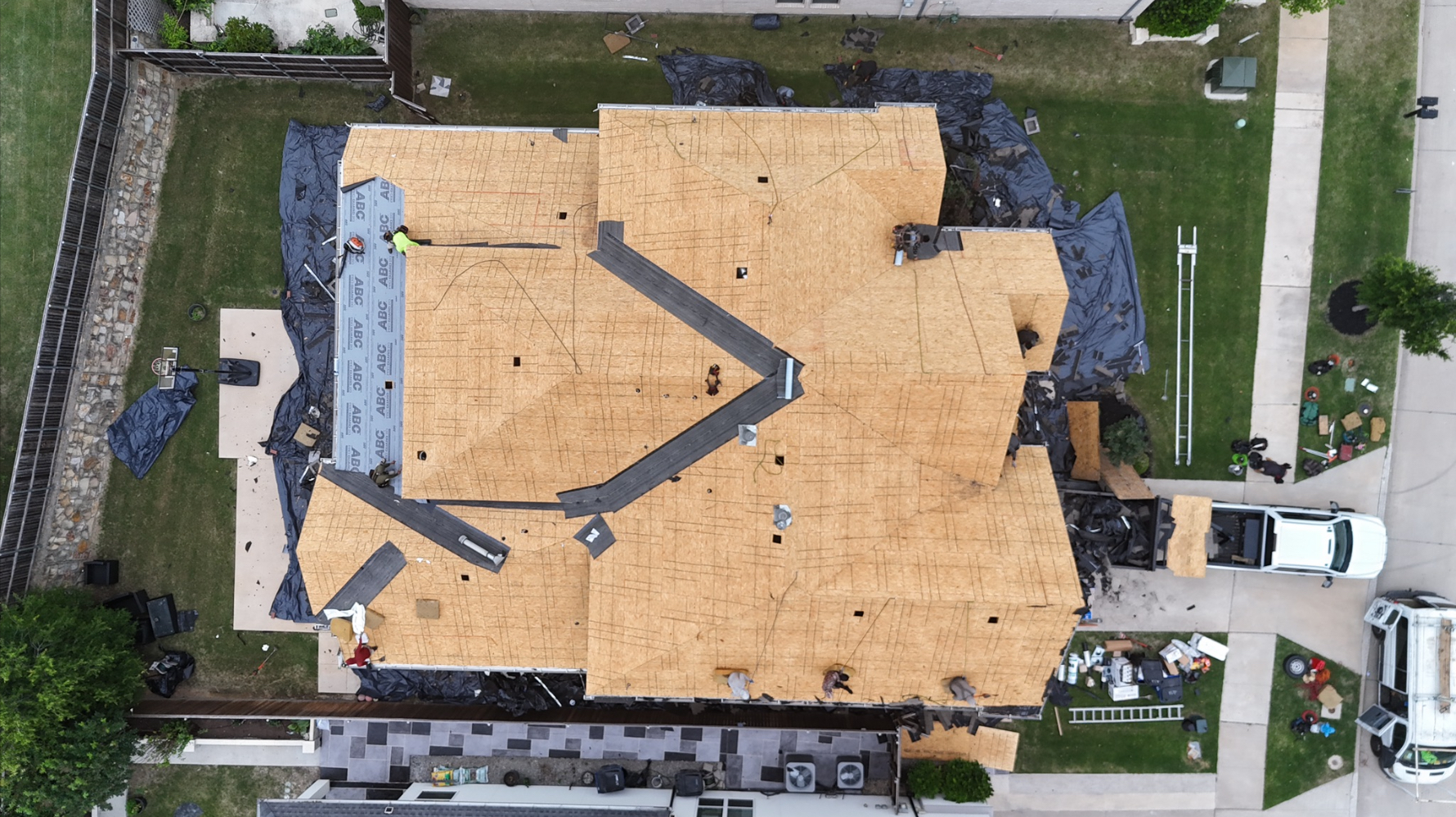 Top-down aerial view of full OSB roof decking with property protection
