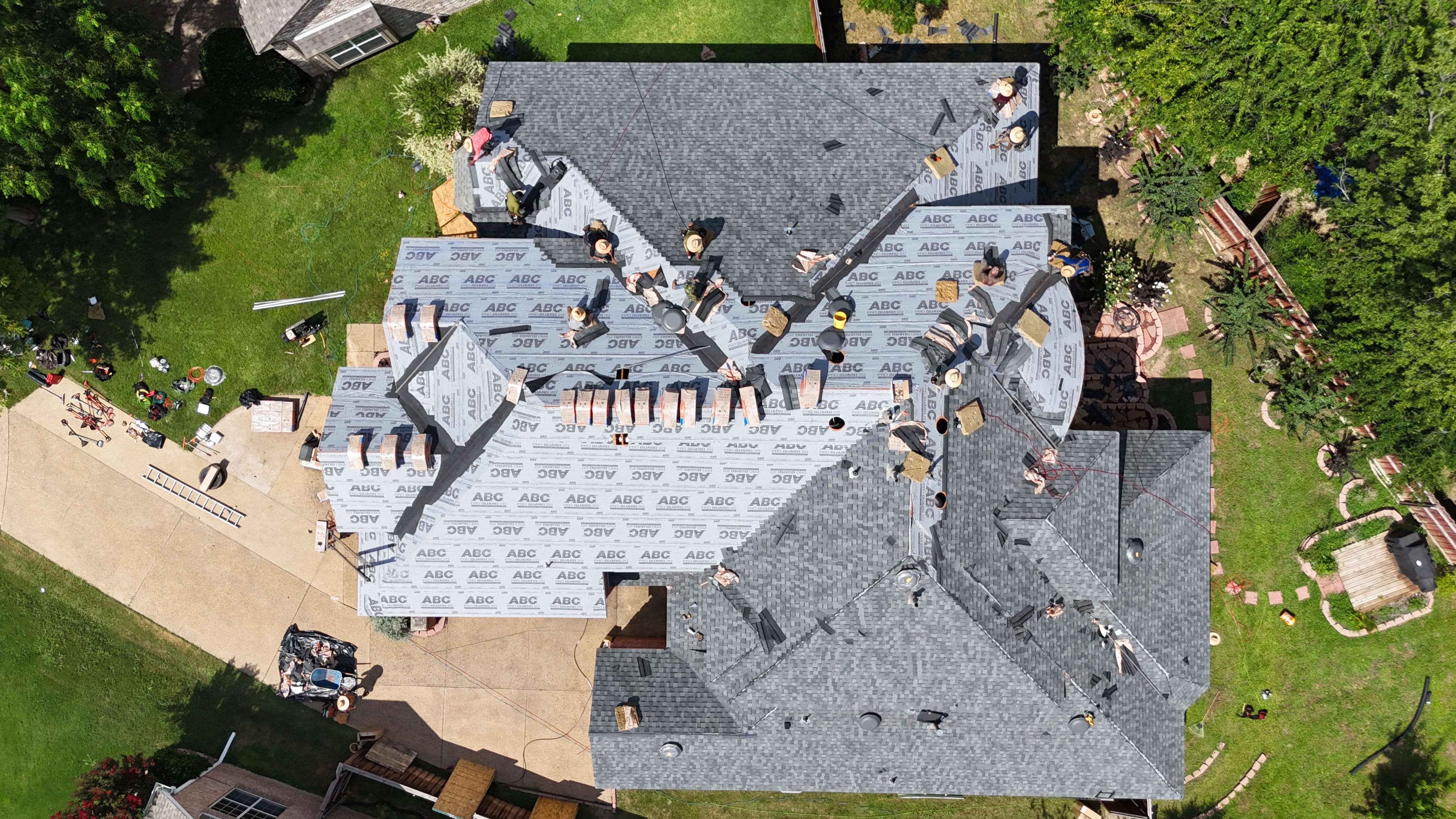 Aerial view of crew installing shingles over ABC Pro Guard underlayment